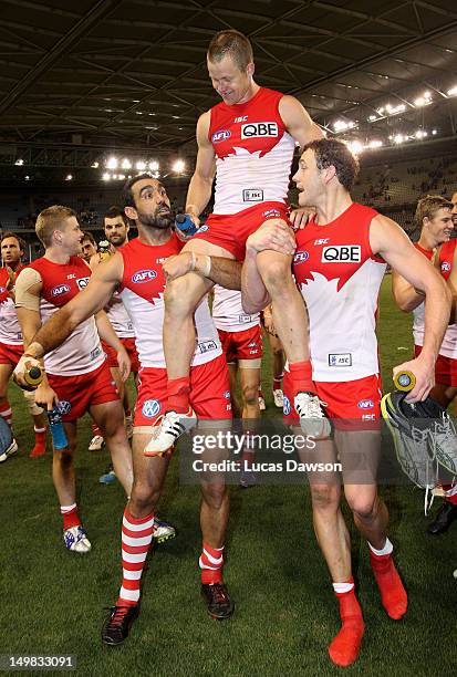 Ryan O'Keefe of Swans is carried of the ground after his 250th game after the round 19 AFL match between the Carlton Blues and the Sydney Swans at...