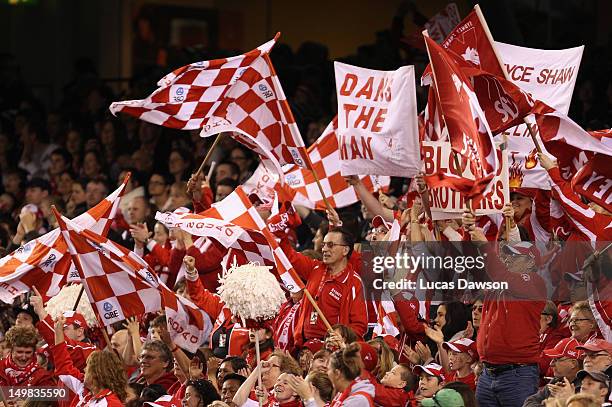 Swans fans celebrate a goal during the round 19 AFL match between the Carlton Blues and the Sydney Swans at Etihad Stadium on August 5, 2012 in...