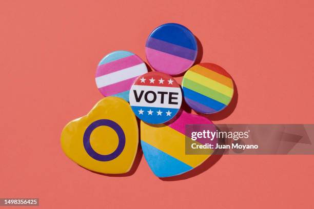 badges with lgbtiq flags and the text vote - democracy vote stock pictures, royalty-free photos & images