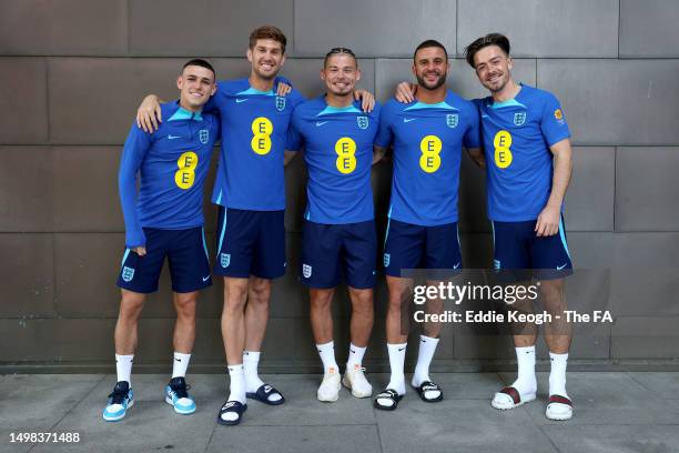 England and Manchester City teammates Phil Foden, John Stones, Kalvin Phillips, Kyle Walker and Jack Grealish of England pose for a photograph at St...