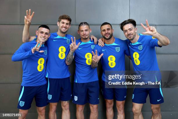 England and Manchester City teammates Phil Foden, John Stones, Kalvin Phillips, Kyle Walker and Jack Grealish of England pose for a photograph at St...