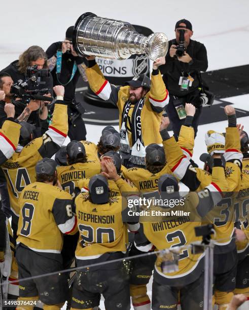 Mark Stone of the Vegas Golden Knights hoists the Stanley Cup after the team's 9-3 victory over the Florida Panthers in Game Five of the 2023 NHL...