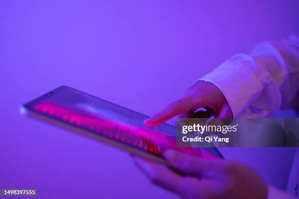 close-up of touching digital tablet - viollet creative selects stock pictures, royalty-free photos & images