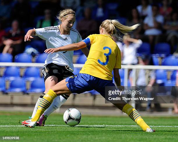 Carolin Simon of Germany battles for the ball with Amanda Ilestedt of Sweden during the women's U20 international friendly match between Germany and...