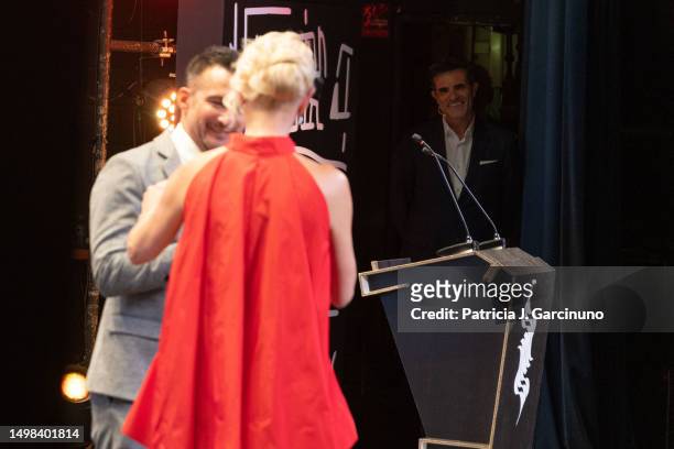 Luis Larrodera look at Alejandro Amenabar and Belen Rueda while he receives an award during the opening ceremony of Alicante Film Festival 2023 at...