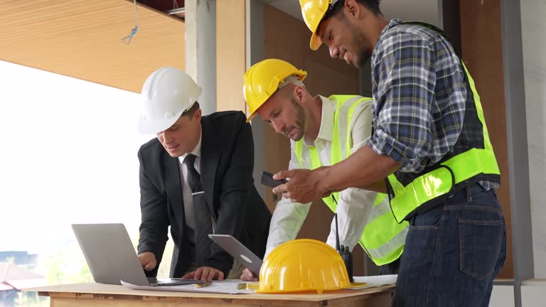 https://media.gettyimages.com/id/1498404998/video/architect-team-working-with-blueprints-for-architectural-plan-engineer-sketching-a.jpg?b=1&s=640x640&k=20&c=82NaZdyLJBHcMjAz4HrUivApVGDgWDKOkM8XErUsB-w=