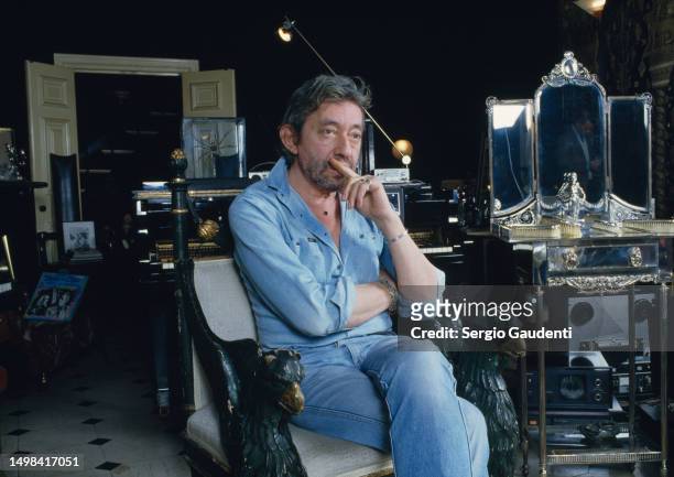 French singer and songwriter Serge Gainsbourg in his Paris home, located on Rue de Verneuil.