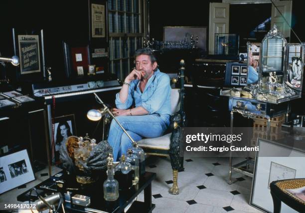 French singer and songwriter Serge Gainsbourg in his Paris home, located on Rue de Verneuil.