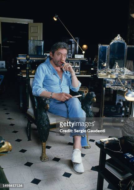 French singer and songwriter Serge Gainsbourg in his Paris home, located on Rue de Verneuil.