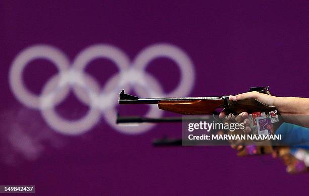 Shooters compete in the men's 50m pistol final at the London 2012 Olympic Games at the Royal Artillery Barracks in London on August 5, 2012. AFP...