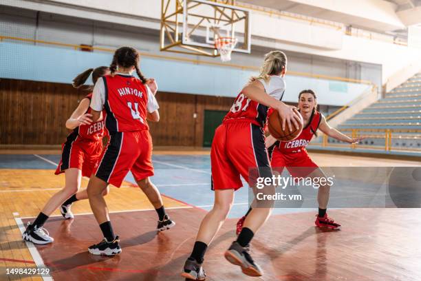 basketball female team training at court - high school basketball stock pictures, royalty-free photos & images