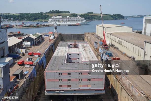 The dry-docked 'Bibby Stockholm', accommodation barge set to be used by the UK government to house up to 500 male asylum seekers off Portland, is...