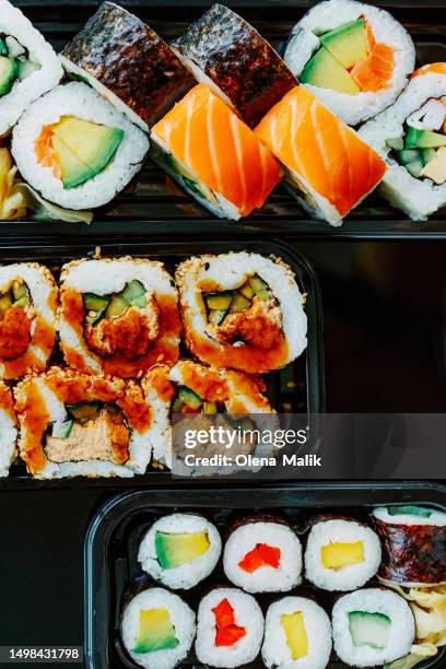 sushi roll set in plastic containers. asian food delivery. take away sushi - maki sushi stock pictures, royalty-free photos & images