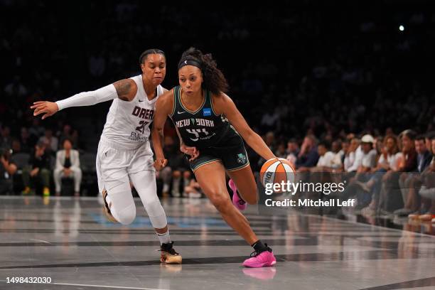 Betnijah Laney of the New York Liberty drives to the basket against AD Durr of the Atlanta Dream in the first half at the Barclays Center on June 13,...