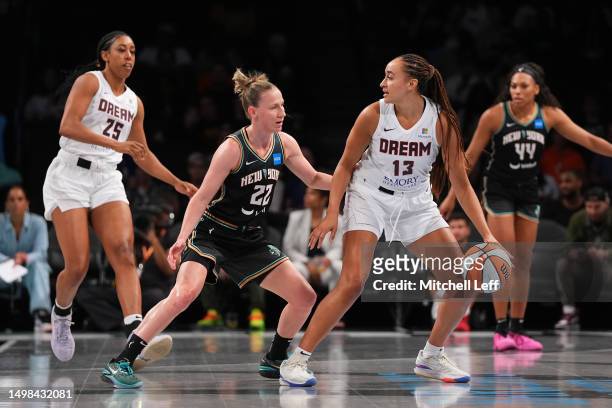 Haley Jones of the Atlanta Dream dribbles the ball against Courtney Vandersloot of the New York Liberty in the first half at the Barclays Center on...