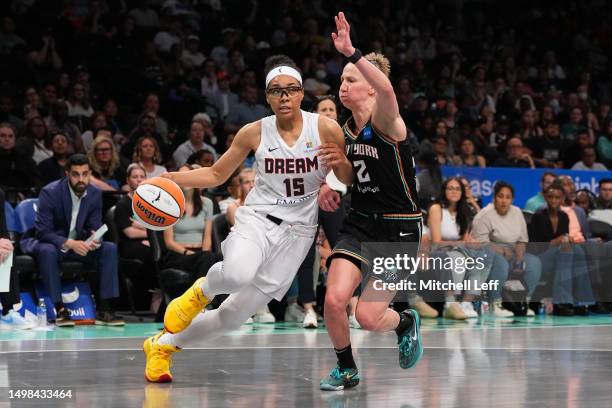 Allisha Gray of the Atlanta Dream drives to the basket against Courtney Vandersloot of the New York Liberty in the second half at the Barclays Center...