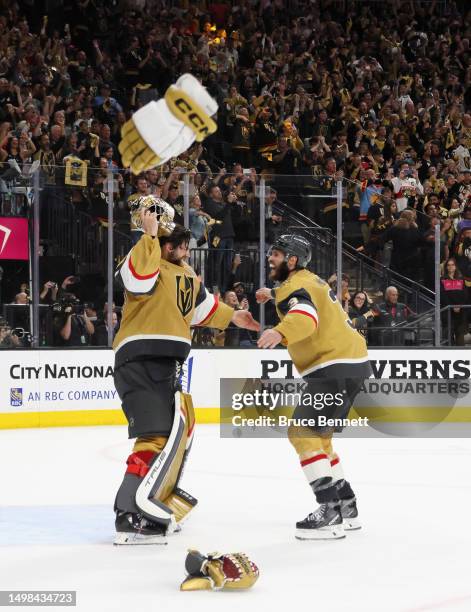 Adin Hill and Brayden McNabb of the Vegas Golden Knights celebrate their Stanley Cup victory over the Florida Panthers in Game Five of the 2023 NHL...