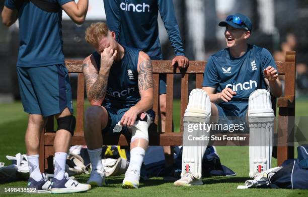 England player Harry Brook shares a joke with Ben Stokes and Mark Wood as they sit on the bench during England nets ahead of the first Ashes Test...