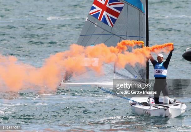 Ben Ainslie of Great Britain celebrates overall victory after competing in the Men's Finn Sailing Medal Race on Day 9 of the London 2012 Olympic...