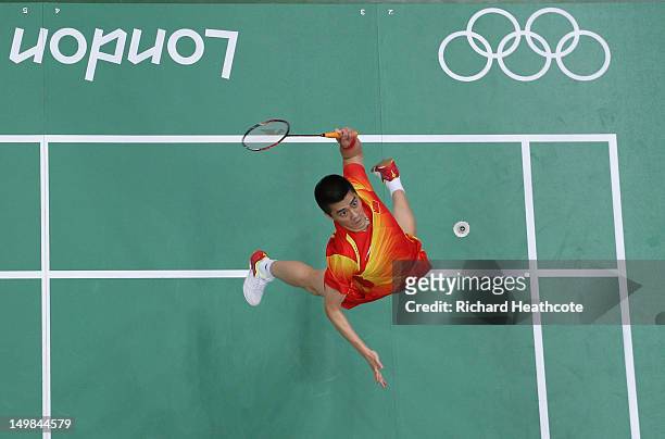 Haifeng Fu of China competes in his Men's Doubles Badminton Gold Medal match against Mathias Boe and Carsten Mogensen of Denmark during Badminton on...