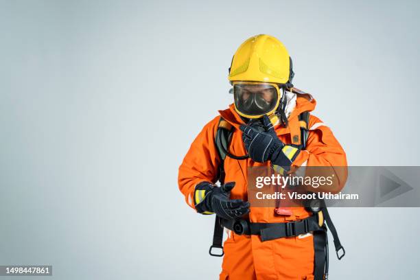 firefighter or emergency team rescue,firefighter on white background. - gasmaske stock-fotos und bilder