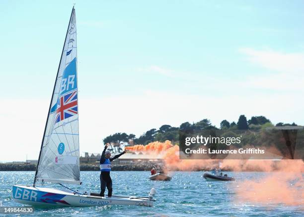 Ben Ainslie of Great Britain celebrates winning gold in the Finn Class Medal race at Weymouth Harbour on August 5, 2012 in Weymouth, England.