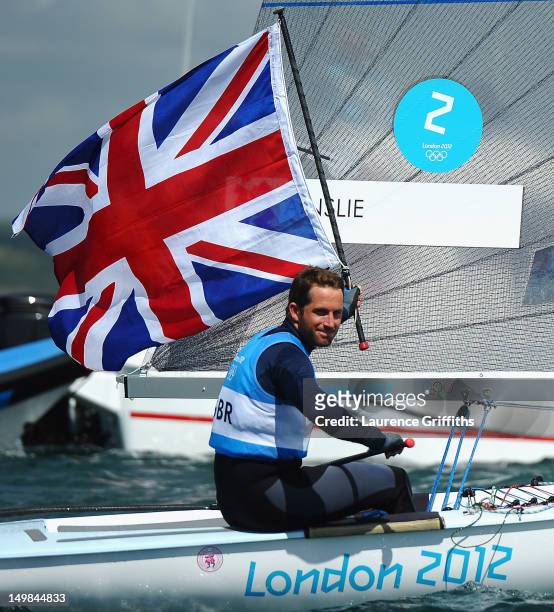 Ben Ainslie of Great Britain celebrates winning gold in the Finn Class Medal race at Weymouth Harbour on August 5, 2012 in Weymouth, England.