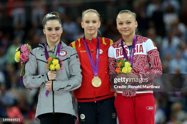 Silver medallist Mc Kayla Maroney of the United States, gold medallist Sandra Raluca Izbasa of Romania and bronze medallist Maria Paseka of Russia...