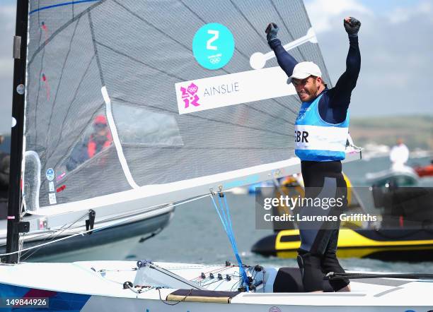 Ben Ainslie of Great Britain celebrates winning gold in the Finn Class Medal race at Weymouth Harbour on August 5, 2012 in Weymouth, England.