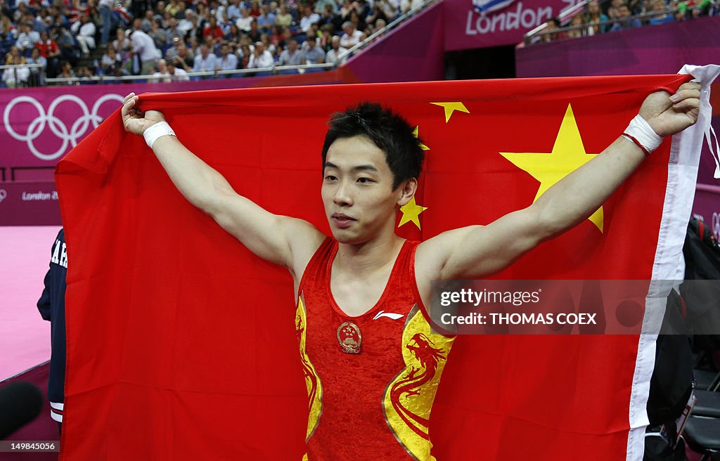 China's gymnast Zou Kai celebrates with 