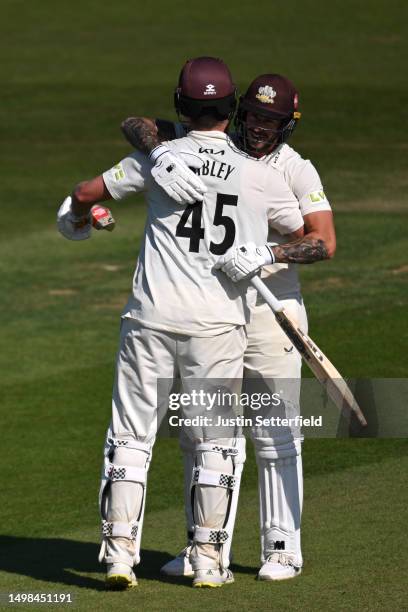 Dom Sibley of Surrey celebrates with Jordan Clark of Surrey after winning the LV= Insurance County Championship Division 1 match between Kent and...