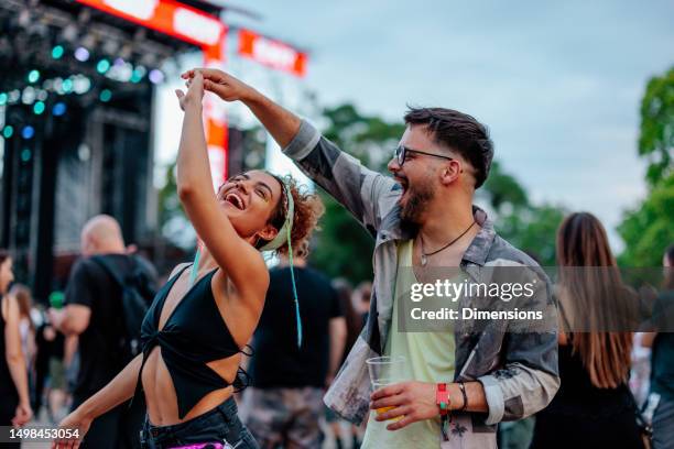 dancing couple at concert - music festival bildbanksfoton och bilder