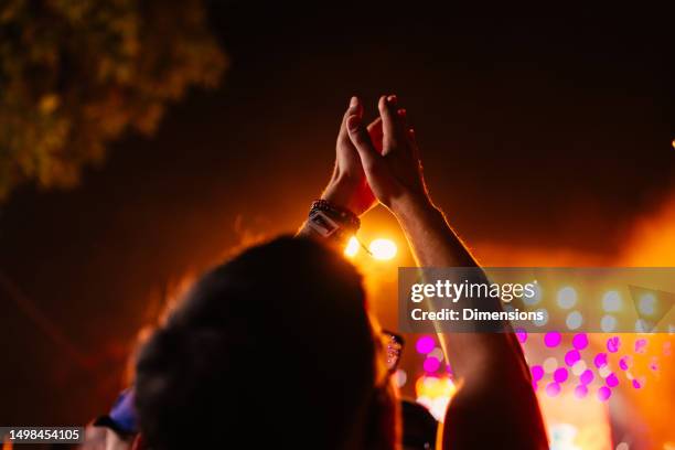 raised hands at music festival. - outdoor concert stage stock pictures, royalty-free photos & images