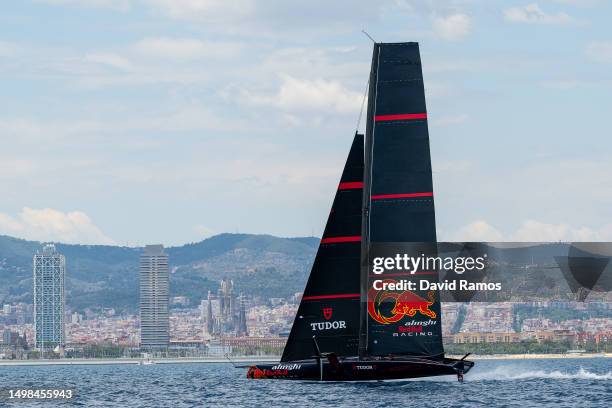 The Alinghi Red Bull Racing AC75 sails pass the Barcelona skyline during a training session on June 14, 2023 in Barcelona, Spain. The Alinghi Red...