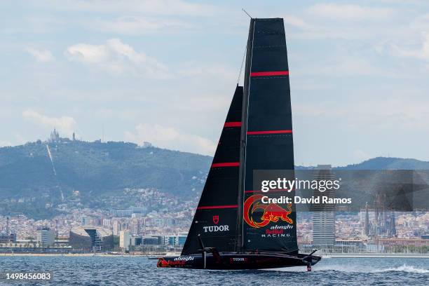 The Alinghi Red Bull Racing AC75 sails pass the Barcelona skyline during a training session on June 14, 2023 in Barcelona, Spain. The Alinghi Red...