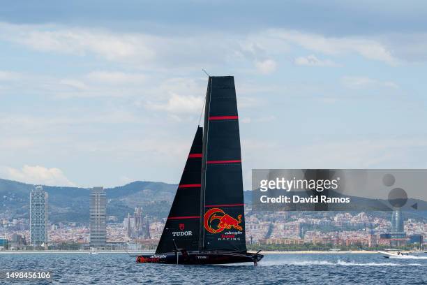 The Alinghi Red Bull Racing AC75 sails pass the Barcelona skyline during a training session on June 14, 2023 in Barcelona, Spain. The Alinghi Red...