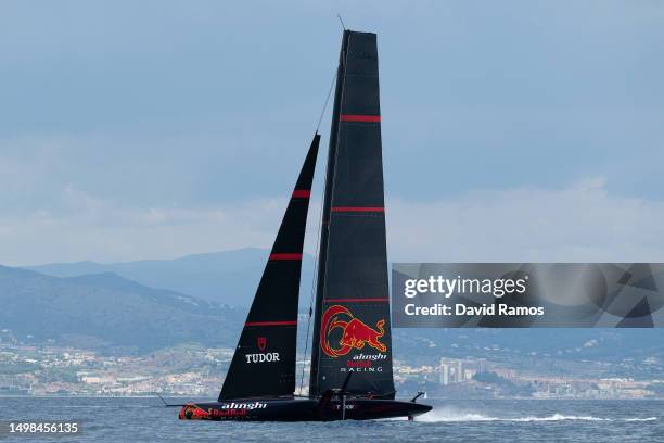 The Alinghi Red Bull Racing AC75 sails pass the Barcelona skyline during a training session on June 14, 2023 in Barcelona, Spain. The Alinghi Red...