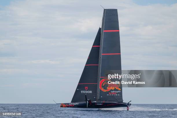 The Alinghi Red Bull Racing AC75 sails pass the Barcelona skyline during a training session on June 14, 2023 in Barcelona, Spain. The Alinghi Red...