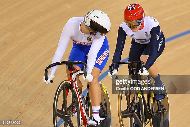 Russia's Ekaterina Gnidenko and Britain's Victoria Pendleton compete during the London 2012 Olympic Games women's sprint round of 16 cycling event at...