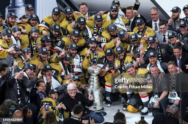 Team captain Mark Stone of the Vegas Golden Knights and teammates pose with the Stanley Cup after their 9-3 victory over the Florida Panthers in Game...
