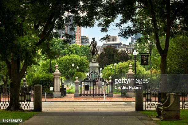 people walk on back bay park path of commonwealth avenue mall in boston massachusetts usa - revolution esplanade monument stock pictures, royalty-free photos & images