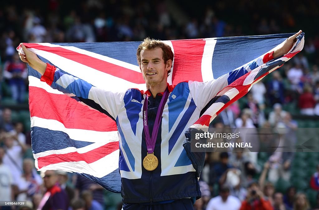 Great Britain's Andy Murray poses with h