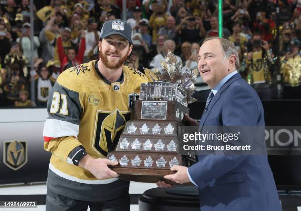 Commissioner Gary Bettman presents Jonathan Marchessault of the Vegas Golden Knights with the Conn Smythe trophy after the Vegas Golden Knights...