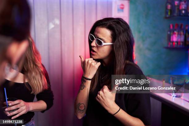woman in sunglasses standing on a disco - funny cocaine stock pictures, royalty-free photos & images