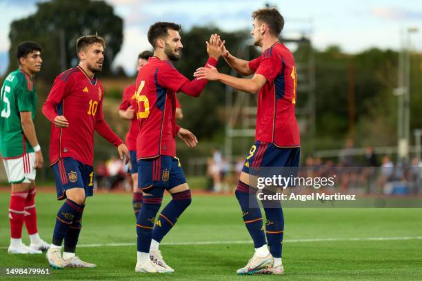 Aimar Oroz of Spain U21 celebrates with Alex Baena after scoring the team's first goal during the International Friendly match between Spain U21 and...
