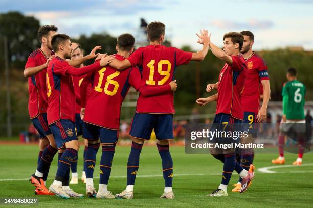 Aimar Oroz of Spain U21 celebrates with team mates after scoring the team's first goal during the International Friendly match between Spain U21 and...