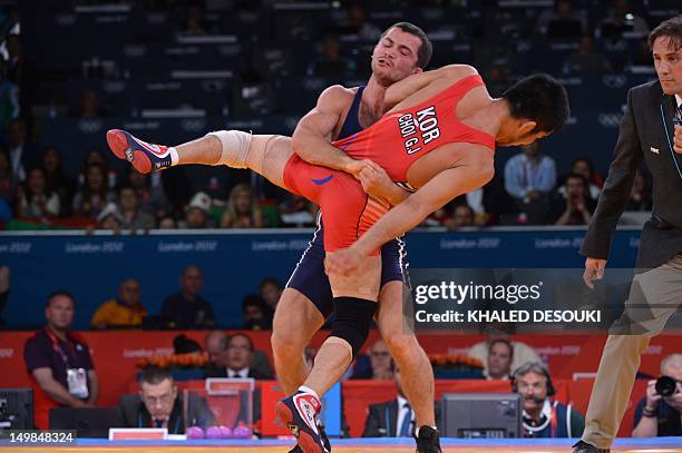 Rovshan Bayramov of Azerbaijan wrestles South Korea's Choi Gyujin during their 55kg Greco Roman Wrestling semi-final match of the London 2012 Olympic...