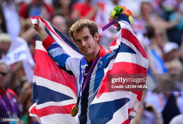 Great Britain's Andy Murray poses with his gold medal at the end of the men's singles tennis tournament of the London 2012 Olympic Games, at the All...