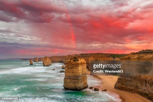 australia, victoria, long exposure of twelve apostles at cloudy dawn - apostles australia stock pictures, royalty-free photos & images