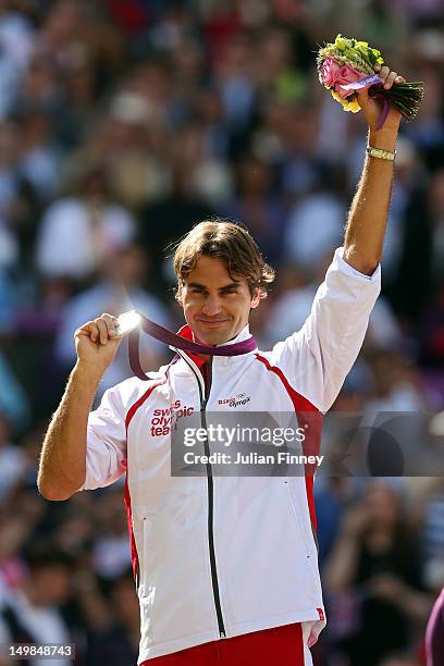 Silver medalist Roger Federer of Switzerland poses during the medal ceremony for the Men's Singles Tennis match on Day 9 of the London 2012 Olympic...